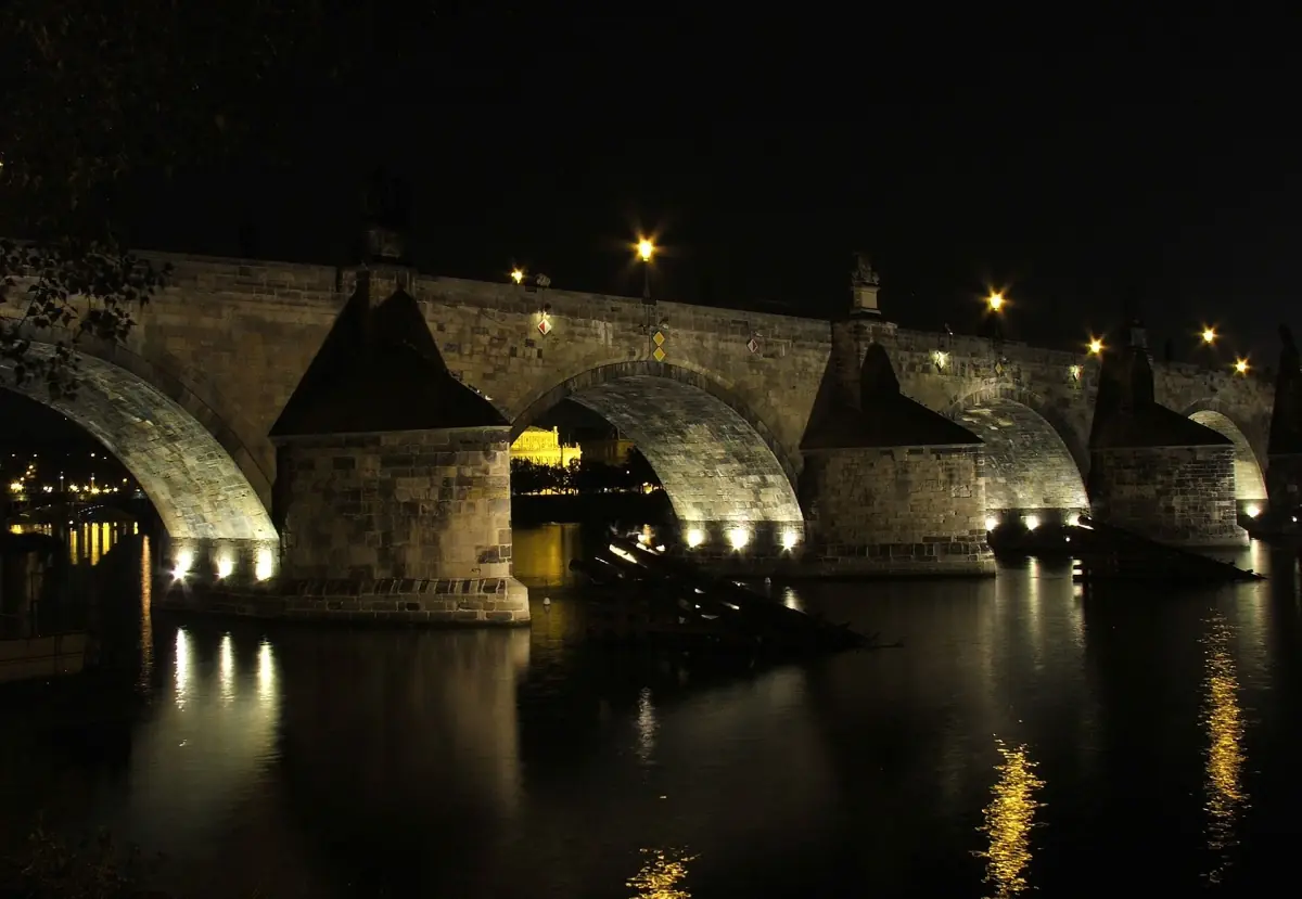 The arches of Charles Bridge lit at night