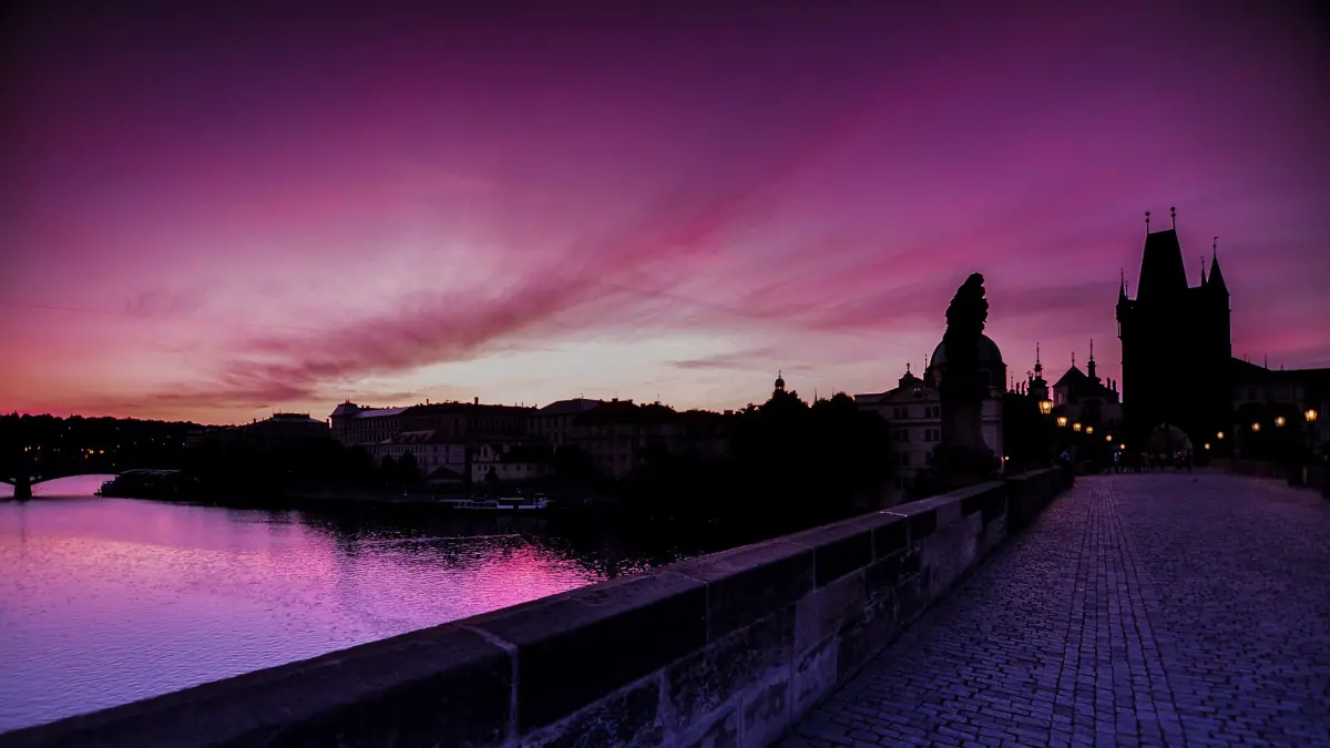 Charles Bridge during a pink sunrise